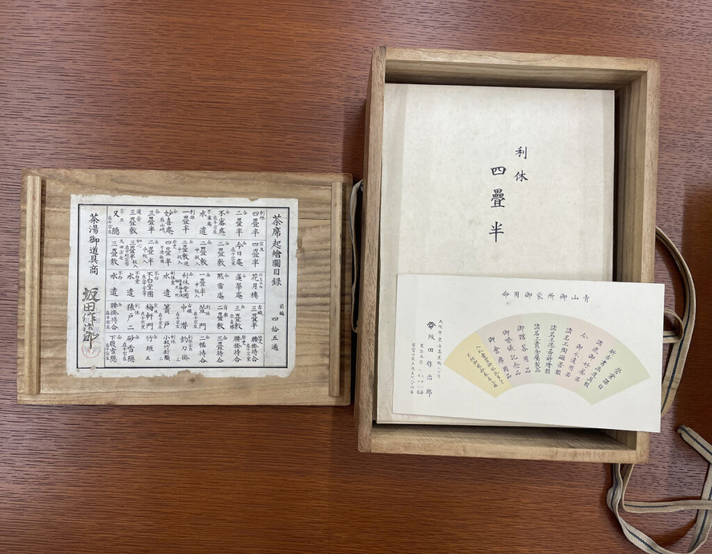 The contents of the materials, enclosed in a wooden box, are displayed on a table