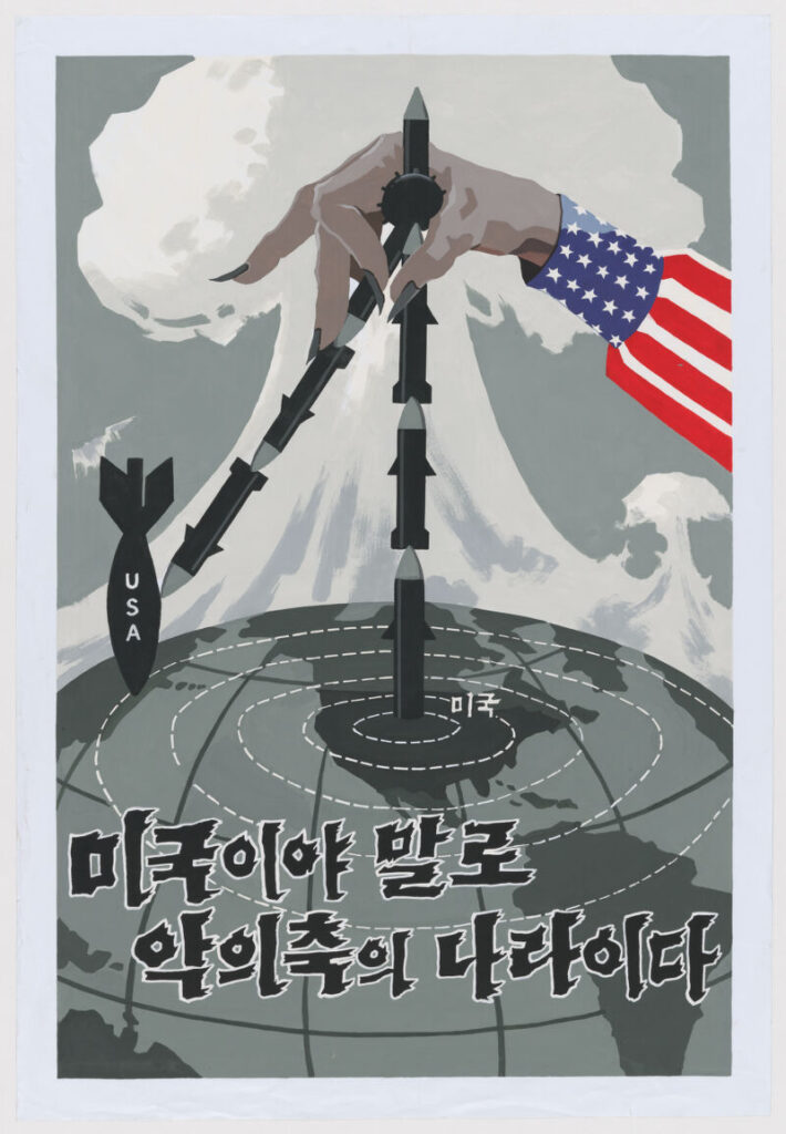 A gray hand with black nails wears a sleeve resembling the American flag. Missiles are shown to be launched from the United States (labeled “miguk” on the map) and headed toward North Korea, with a mushroom cloud in the background hinting at nuclear threat