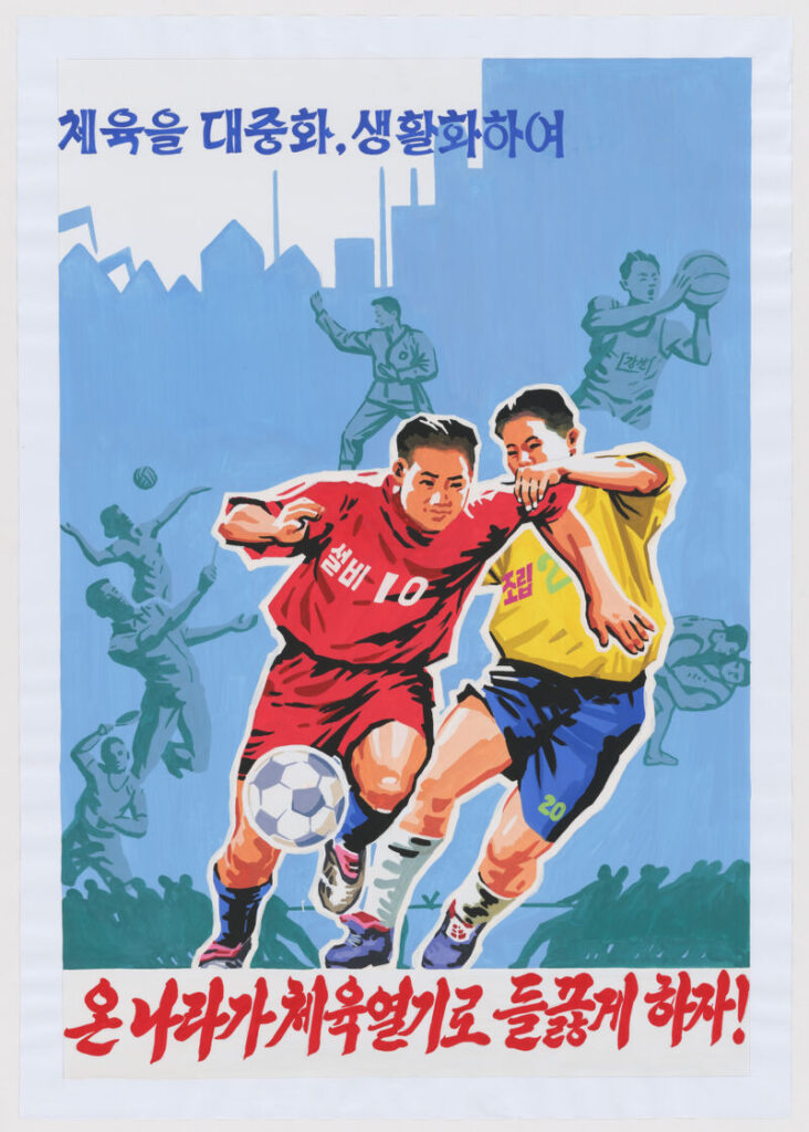 Two soccer players, one in red and one in yellow and blue, vie for the ball